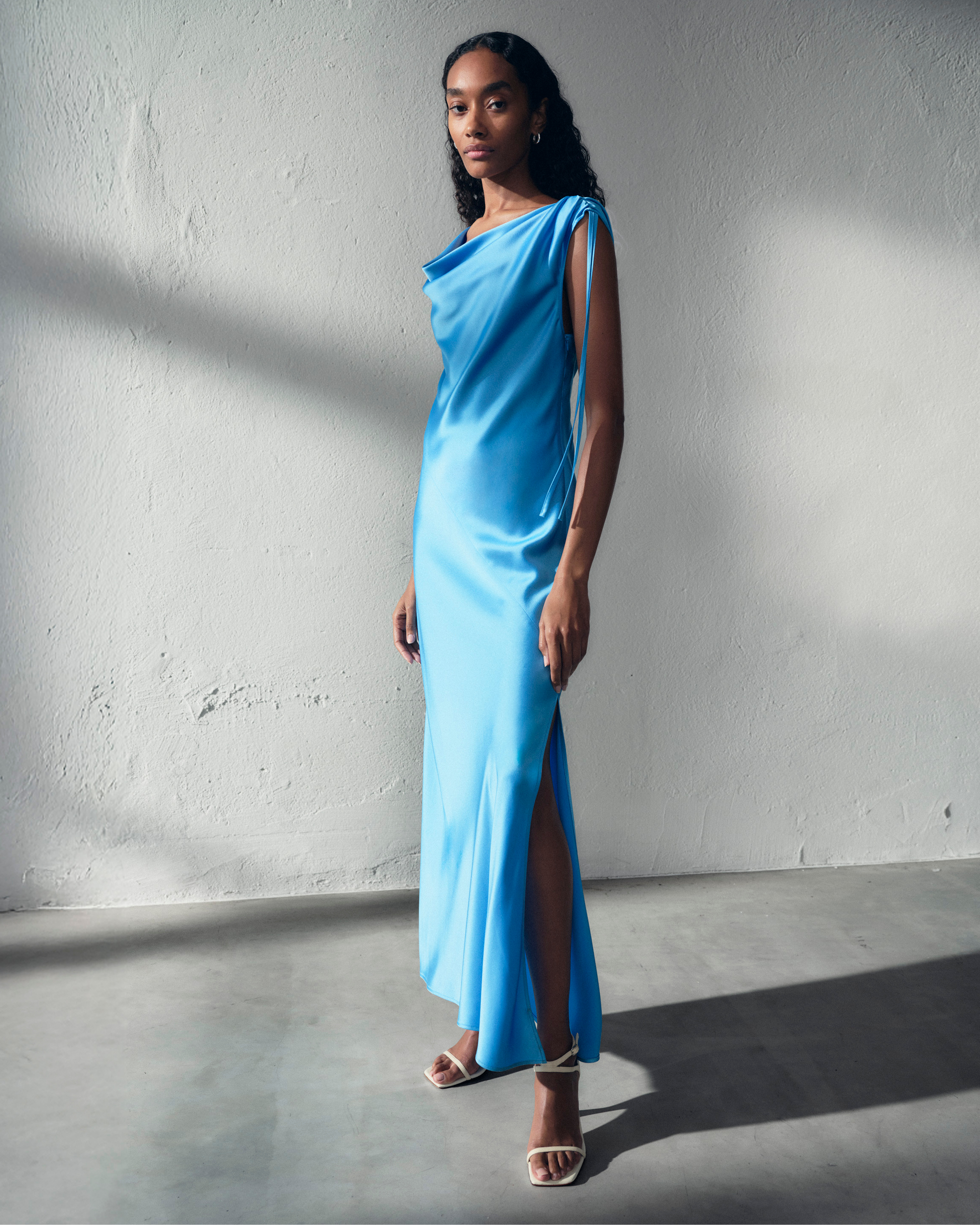 Woman in light blue satin dress